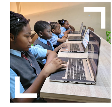 photo of children on laptops