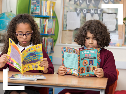 2 children reading When Science Experiments Go Wrong and Amazing Men in Black History from the Astro strand of Reading Planet