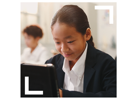 photo of primary learner working on tablet