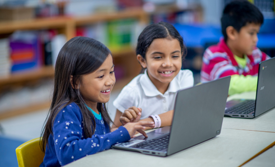 two primary school children in class