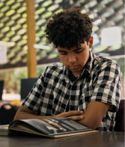 students reading textbook