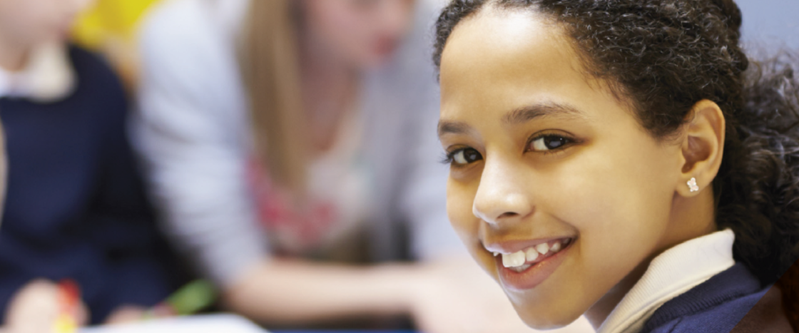 child smiling at the camera