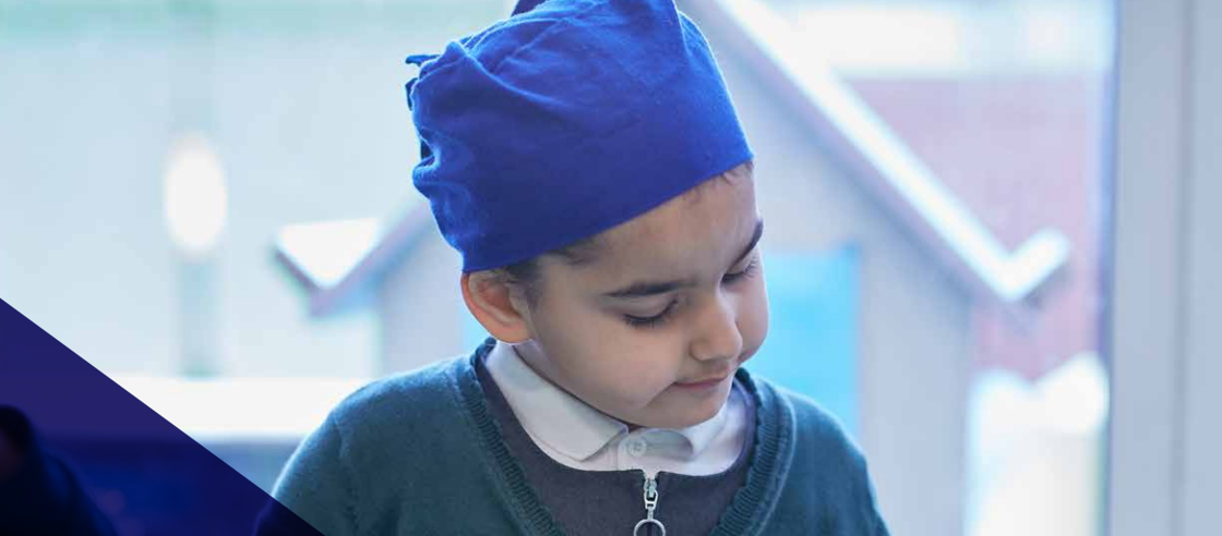 child looking thoughtful in blue turban